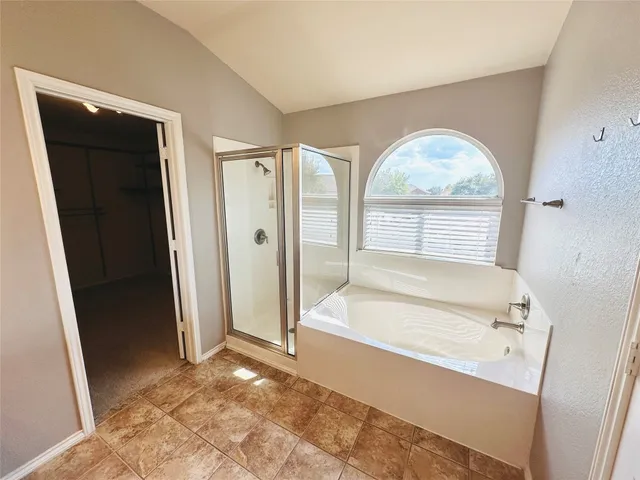 a bathroom with a sink a mirror and a shower