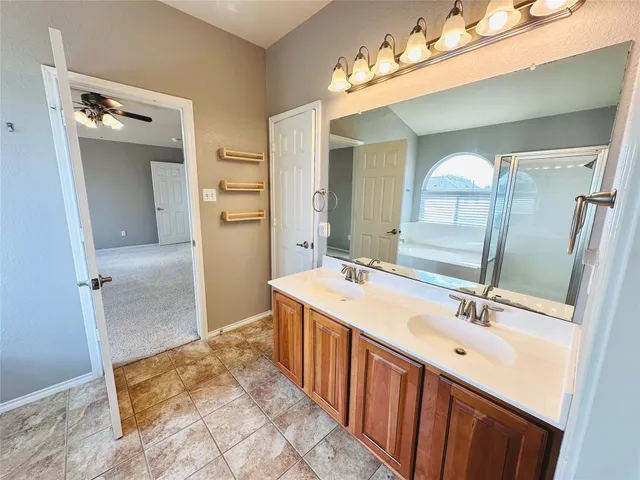 a bathroom with a bathtub and a shower