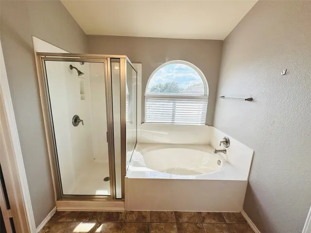 a view of a bathroom from a hallway