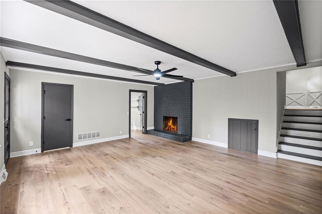 7 East Creekview Drive Southwest Rome, GA 30165 - Photo 26 of 43 a view of empty room with wooden floor and fireplace