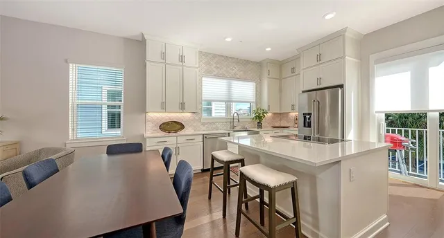 a bathroom with a granite countertop sink mirror and a toilet