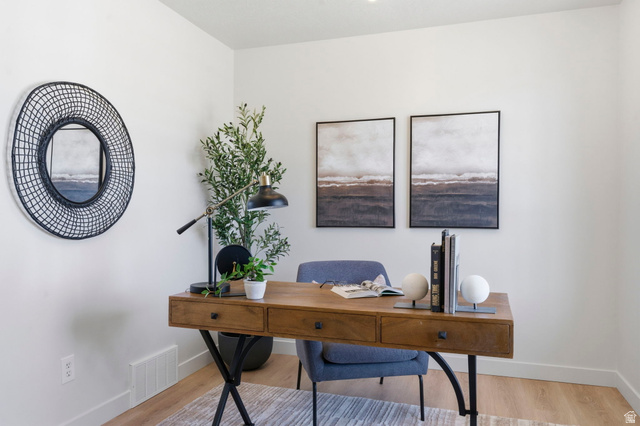 2460 Allison Way Syracuse, UT 84075 - Photo 10 of 24 Light-filled room featuring recessed ceiling lighting, wood-finish flooring, and white baseboards