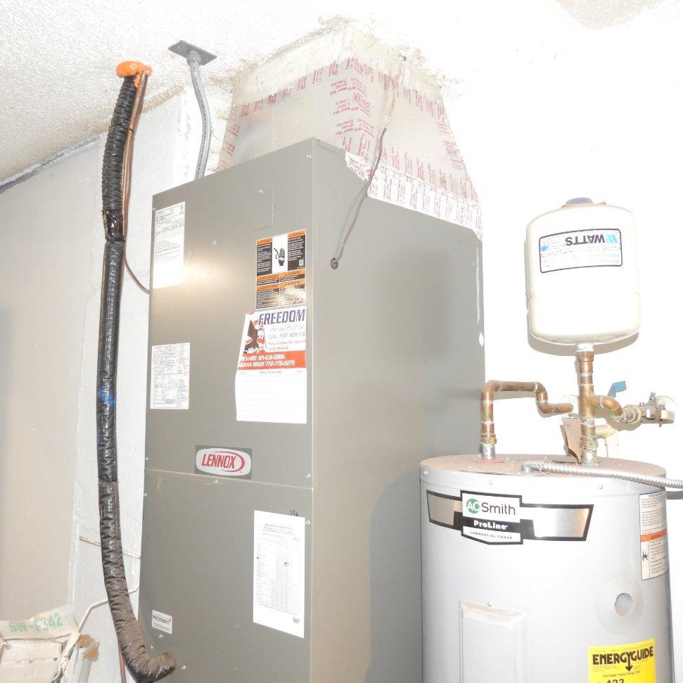 1470 Southeast Portillo Road Port St. Lucie, FL 34952 - Photo 31 of 42 AC / Hot Water Tank