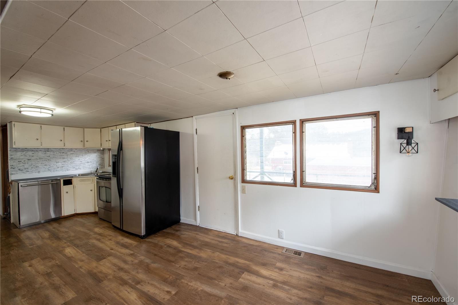 122 Neal Road Bailey, CO 80421 - Photo 9 of 25 a view of an empty room with a window