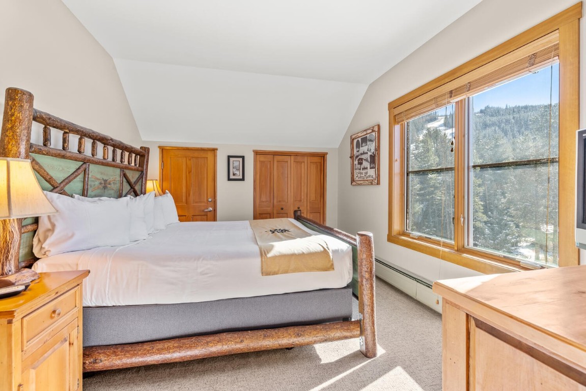 129 River Run Road, Unit 8031 Keystone, CO 80435 - Photo 17 of 30 a bedroom with a bed and a large window