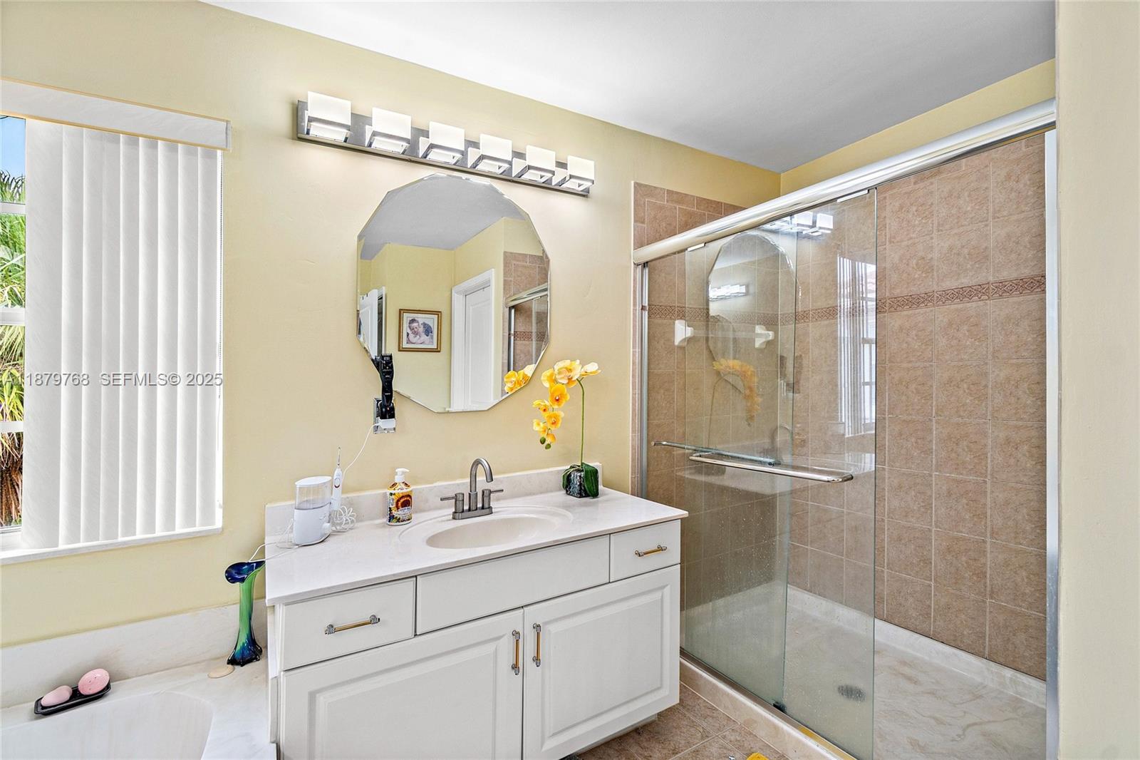 571 Calamint Point Royal Palm Beach, FL 33411 - Photo 20 of 51 a bathroom with a double vanity sink mirror and shower