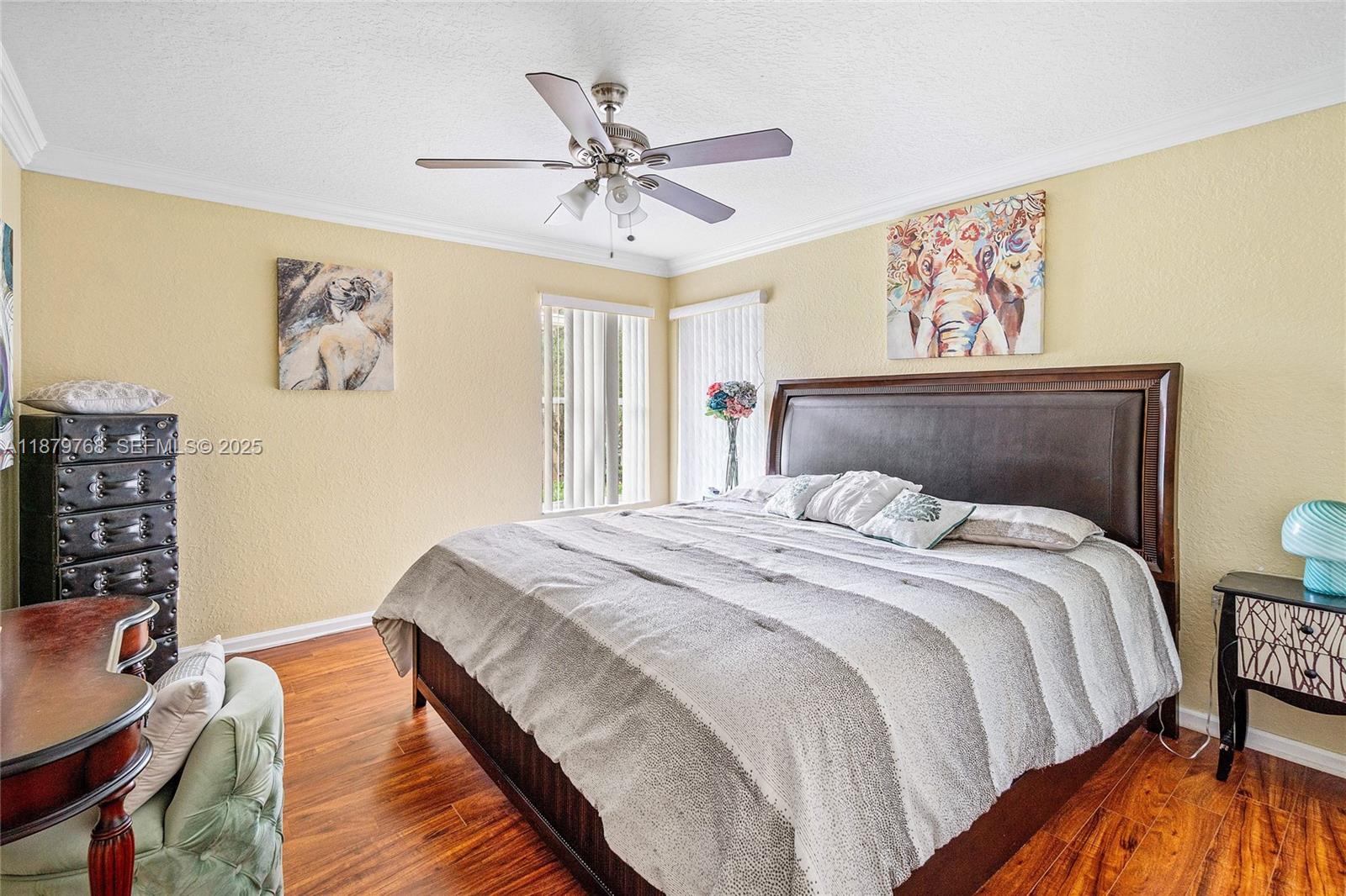 571 Calamint Point Royal Palm Beach, FL 33411 - Photo 21 of 51 a bedroom with a bed and wooden floor