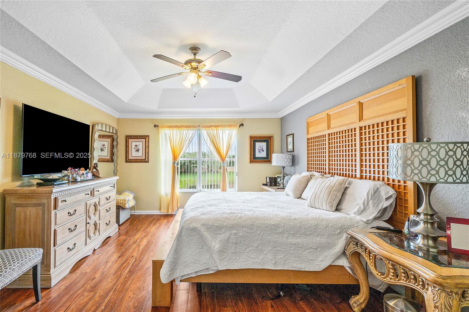 571 Calamint Point Royal Palm Beach, FL 33411 - Photo 24 of 51 a bedroom with a bed and a flat screen tv