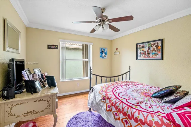 a bedroom with a bed and dresser