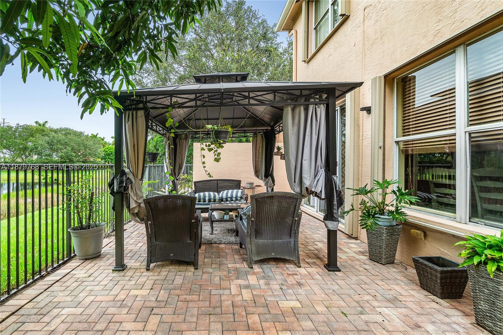571 Calamint Point Royal Palm Beach, FL 33411 - Photo 32 of 51 a view of outdoor space yard and patio