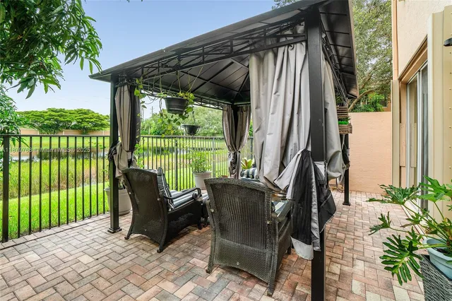 a view of balcony with furniture and garden