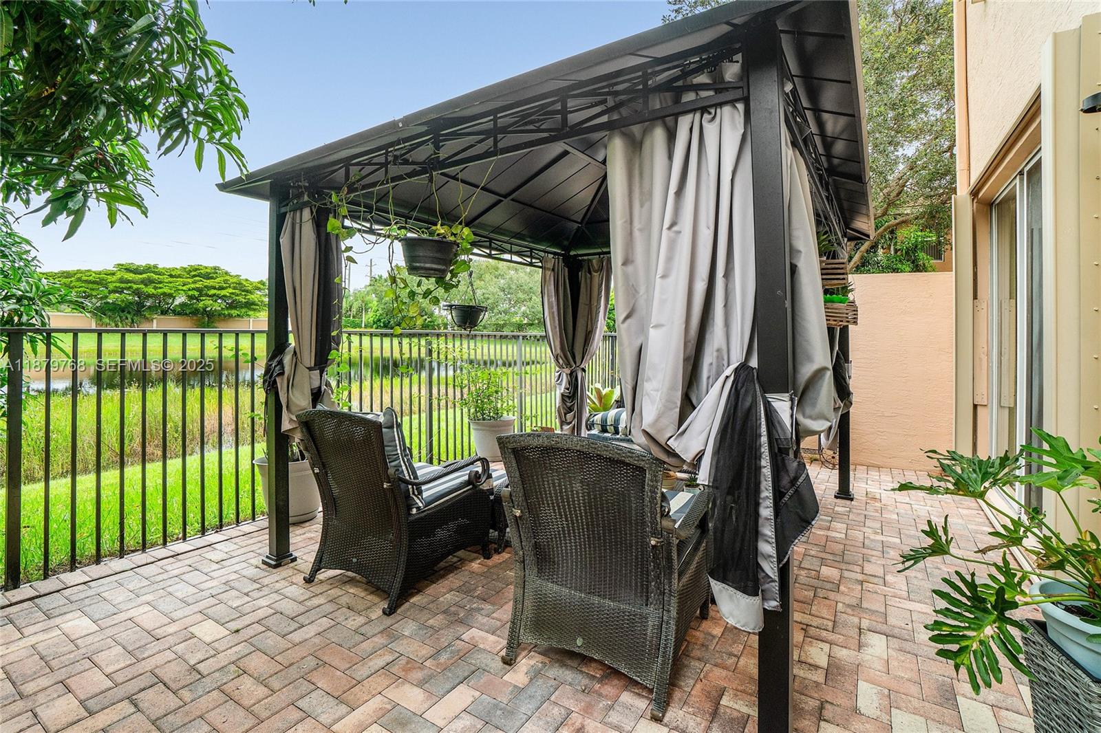 571 Calamint Point Royal Palm Beach, FL 33411 - Photo 33 of 51 a view of balcony with furniture and garden