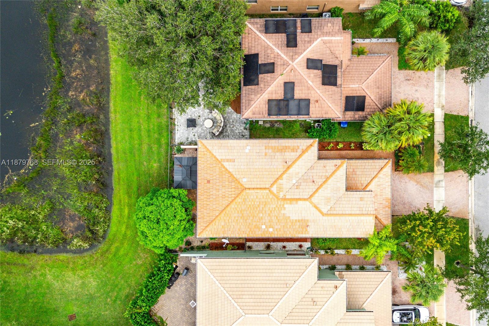 571 Calamint Point Royal Palm Beach, FL 33411 - Photo 43 of 51 an aerial view of a house with a yard