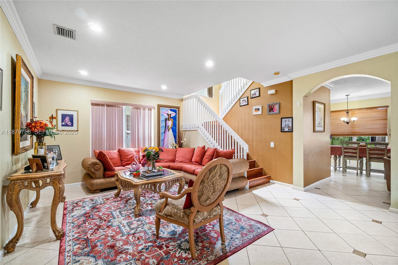 571 Calamint Point Royal Palm Beach, FL 33411 - Photo 7 of 51 a dining room with furniture and a livingroom