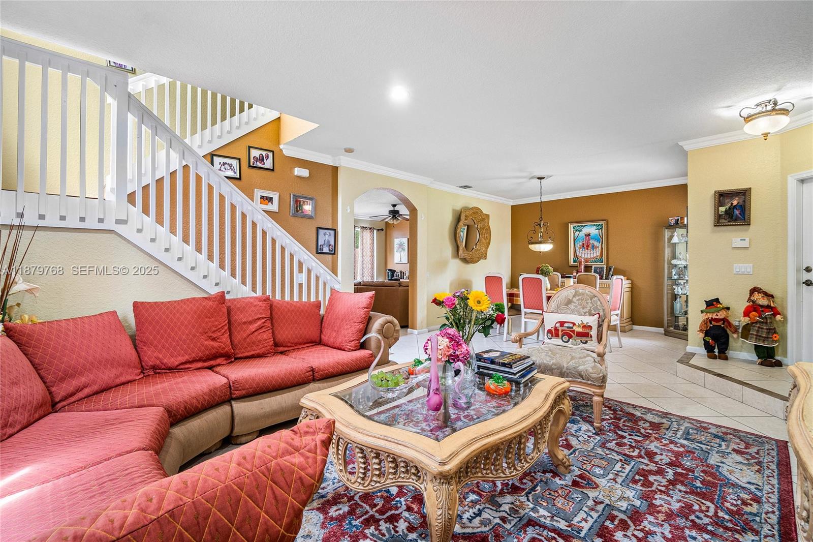 571 Calamint Point Royal Palm Beach, FL 33411 - Photo 8 of 51 a living room with furniture a rug and a large window