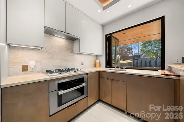 a kitchen with a stove and a sink