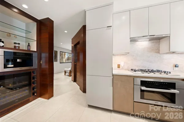 a kitchen with a stove and a refrigerator