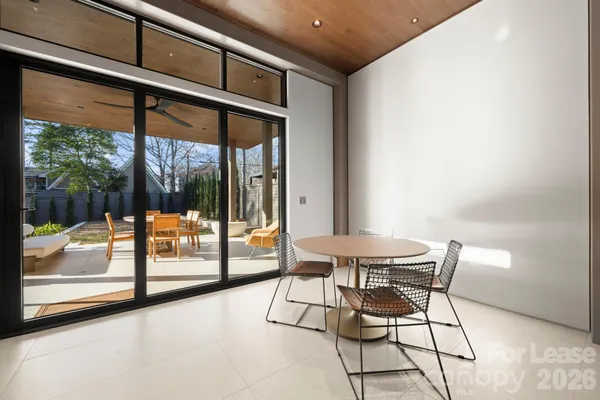 a view of a room with furniture and wooden floor