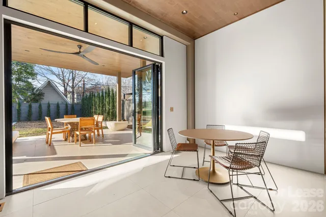 a bed room with a bed and a large window