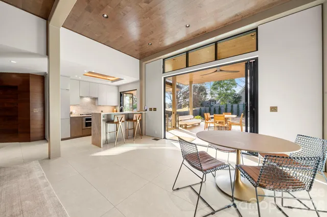 a bedroom with a bed and a large mirror