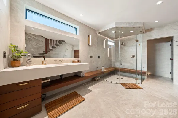 a bathroom with a double vanity sink mirror and double
