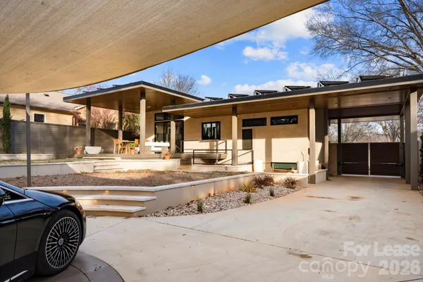 a view of a house with entrance gate