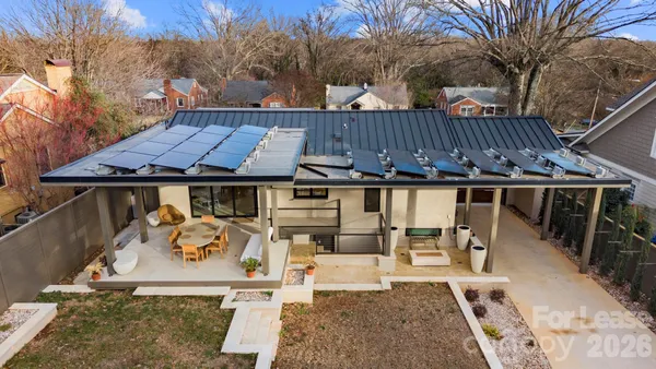a view of a patio with table and chairs with wooden floor and fence