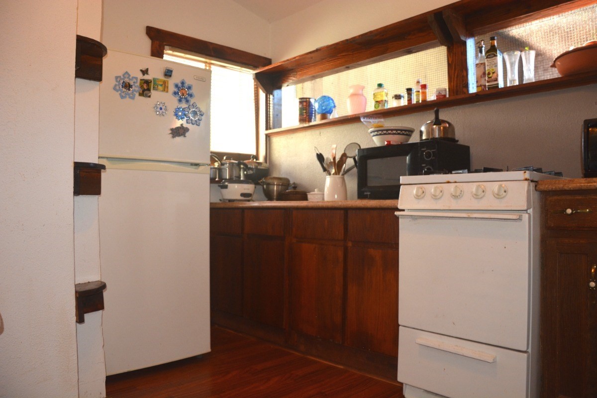 3917 Koula Road, Unit 2 Hanapepe, HI 96716 - Photo 12 of 21 a kitchen with a refrigerator and a stove