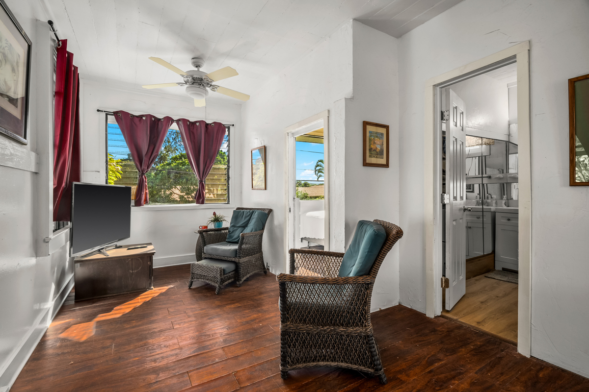3917 Koula Road, Unit 2 Hanapepe, HI 96716 - Photo 2 of 21 a living room with furniture a flat screen tv and a window