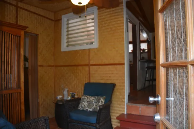 a view of a balcony with wooden floor and furniture