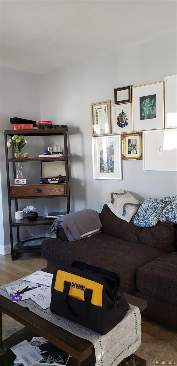 1644 Race Street Denver, CO 80206 - Photo 2 of 6 a living room with furniture and a couch