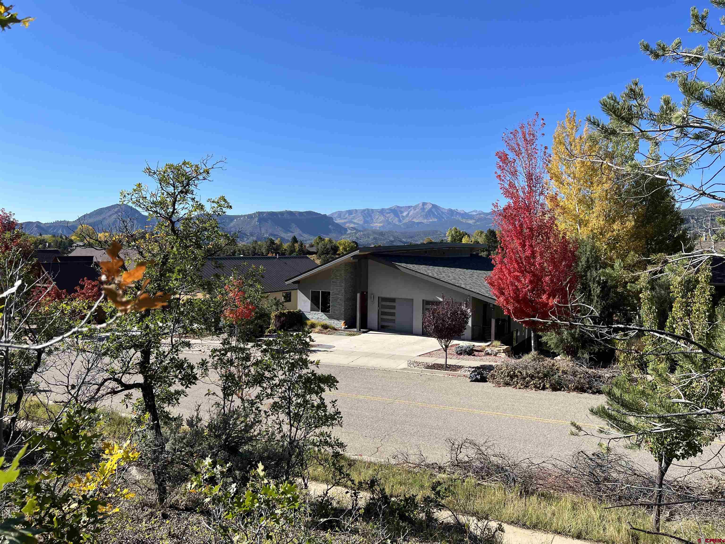 24 Lizard Head Drive Durango, CO 81301 - Photo 3 of 21 a front view of a house with a yard covered with snow