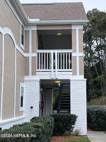 a kitchen with stainless steel appliances a stove top oven a sink and a refrigerator