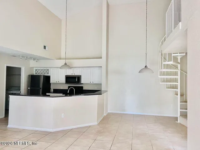 a view of kitchen island with wooden floor