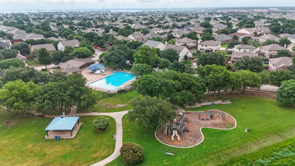 13268 Fencerow Road Fort Worth, TX 76244 - Photo 24 of 25 Community park featuring a swimming pool, playground, covered picnic area, and paved walking paths, surrounded by residential properties