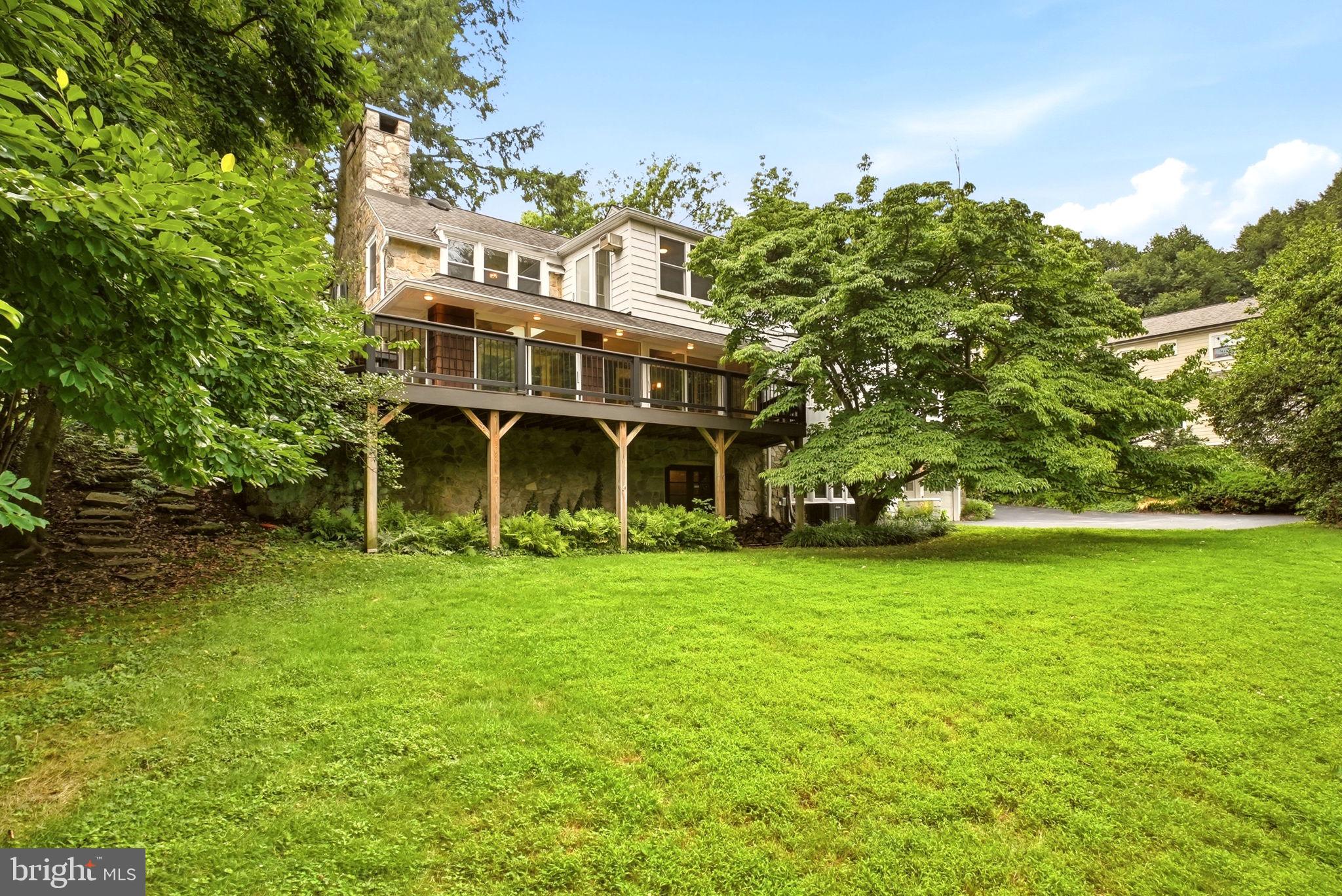 419 Riverview Road Swarthmore, PA 19081 - Photo 67 of 70 a view of a big house with a big yard and large trees