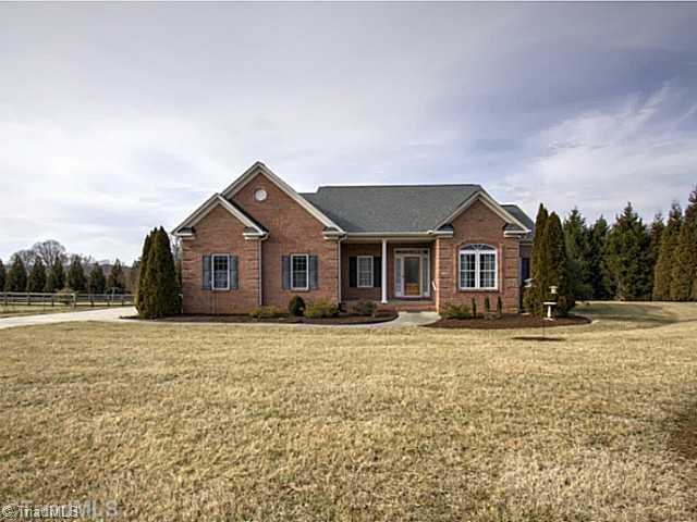 4513 Peeples Road Oak Ridge, NC 27310 - Photo 1 of 16 Exterior Front.