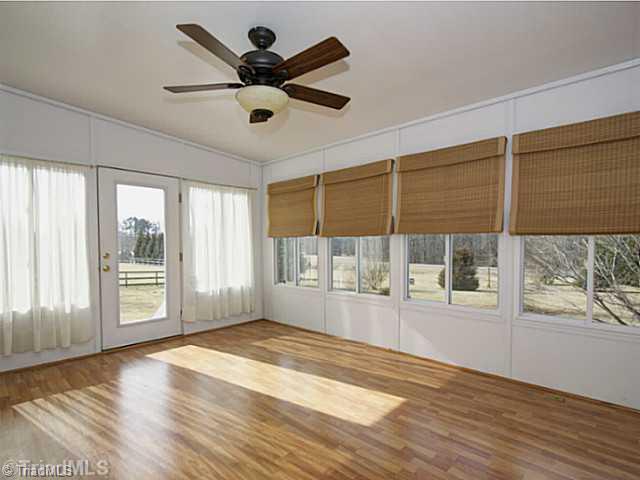 4513 Peeples Road Oak Ridge, NC 27310 - Photo 13 of 16 Sunroom.