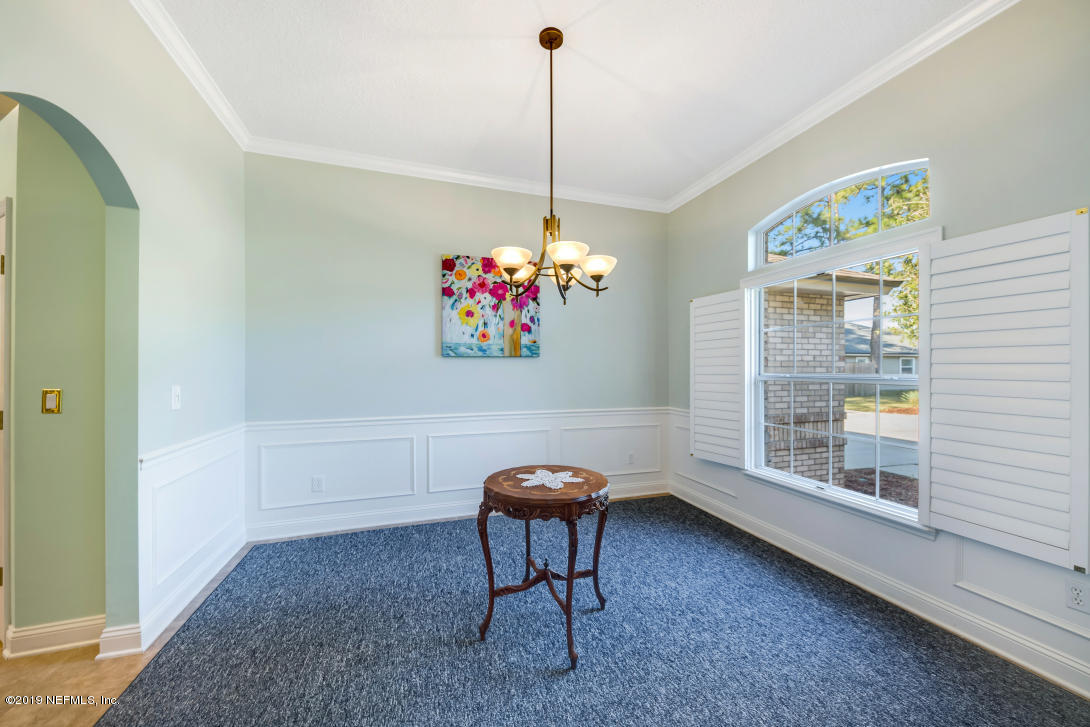87465 Creekside Drive Yulee, FL 32097 - Photo 11 of 40 a living room with furniture and a window