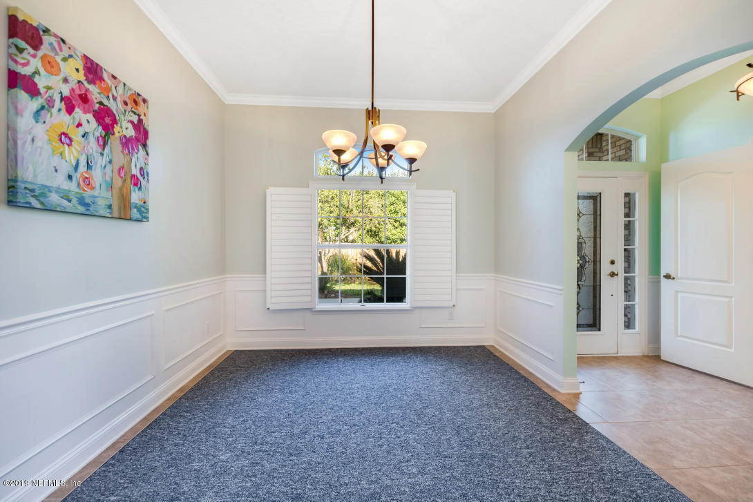 87465 Creekside Drive Yulee, FL 32097 - Photo 15 of 40 wooden floor in an empty room with a window