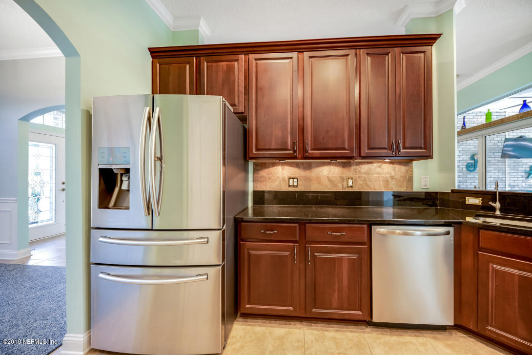 87465 Creekside Drive Yulee, FL 32097 - Photo 17 of 40 a white refrigerator freezer sitting in a kitchen