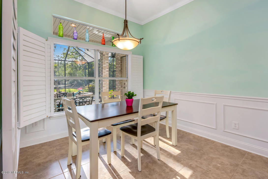 87465 Creekside Drive Yulee, FL 32097 - Photo 20 of 40 a view of a dining room with furniture window and outside view