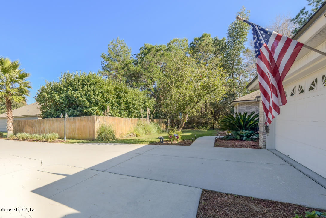 87465 Creekside Drive Yulee, FL 32097 - Photo 5 of 40 a view of a street with a building in the background