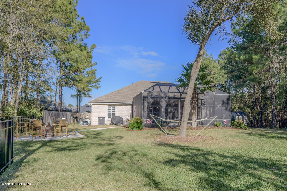 87465 Creekside Drive Yulee, FL 32097 - Photo 8 of 40 a view of a house with a yard