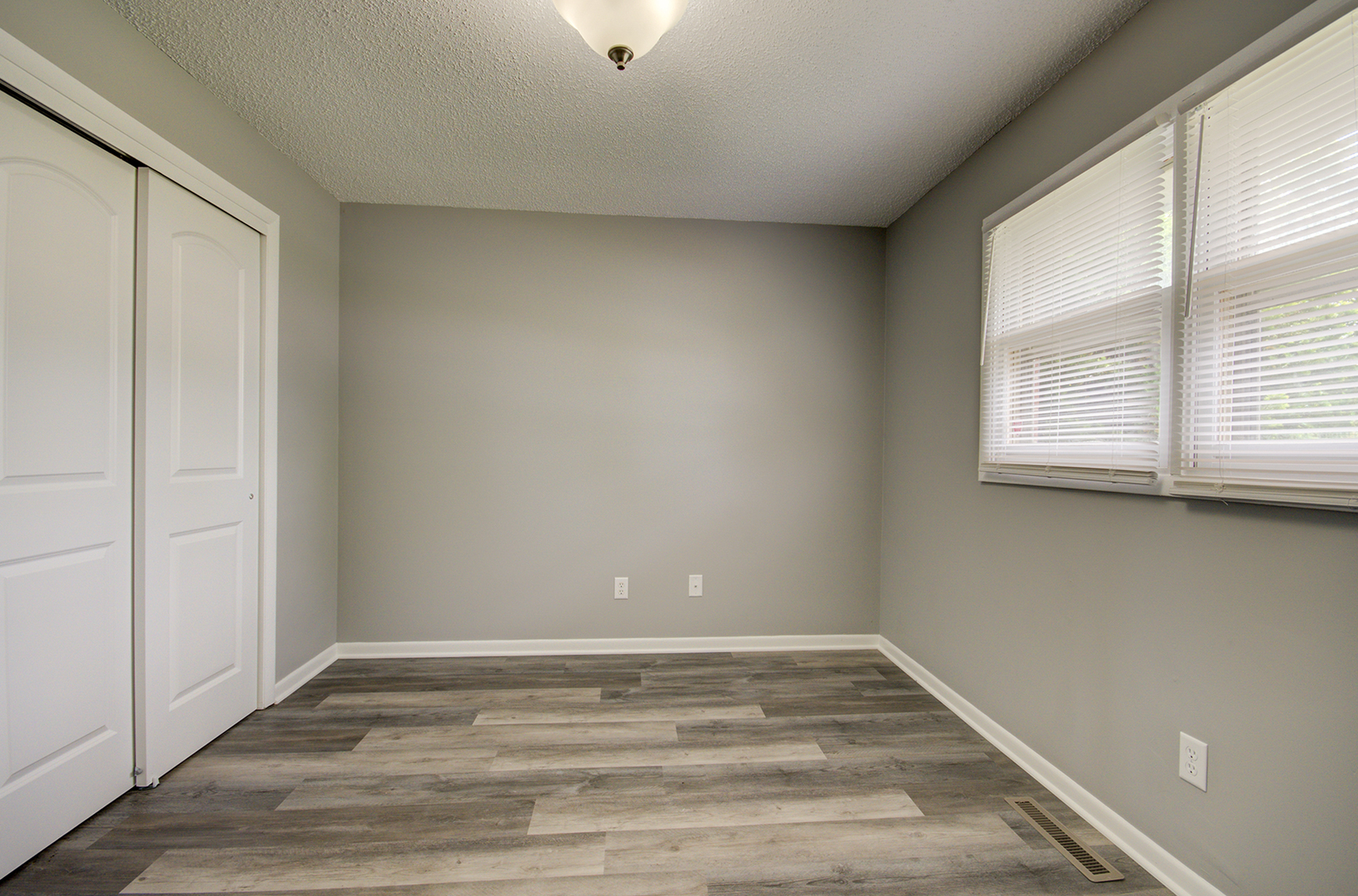 1354 Georgetown Drive Bourbonnais, IL 60914 - Photo 13 of 18 a view of empty room with wooden floor and fan