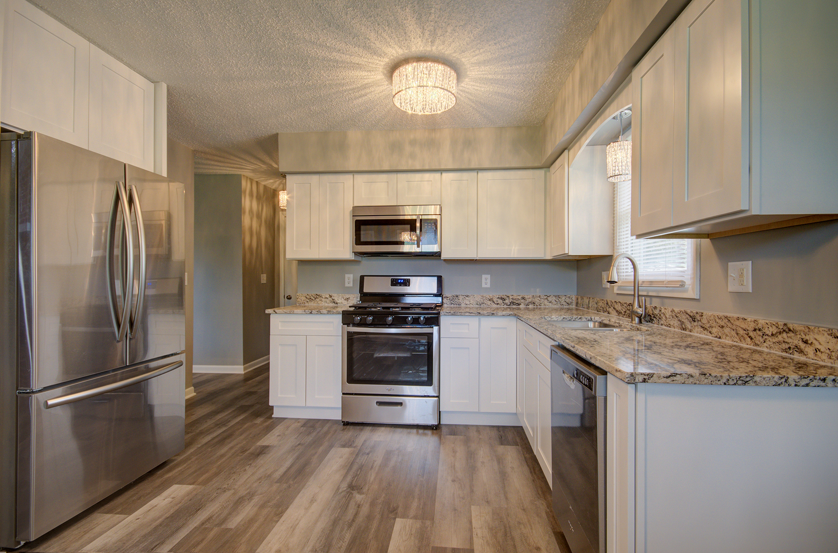 1354 Georgetown Drive Bourbonnais, IL 60914 - Photo 4 of 18 a kitchen with a sink stainless steel appliances and cabinets