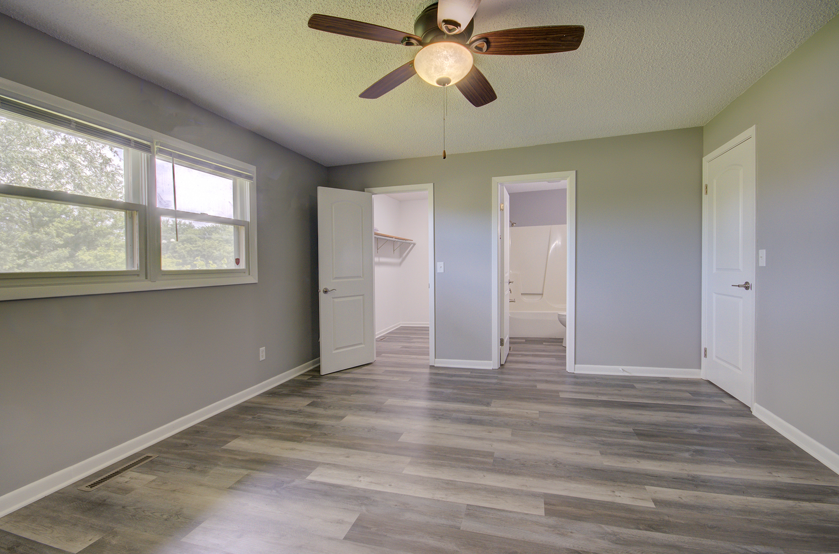 1354 Georgetown Drive Bourbonnais, IL 60914 - Photo 8 of 18 a view of an empty room with a window