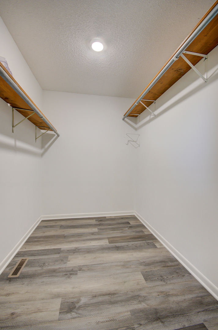 1354 Georgetown Drive Bourbonnais, IL 60914 - Photo 9 of 18 a view of a room with racks on the wall