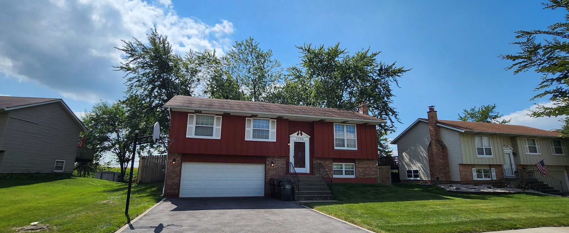 a front view of a house with a garden