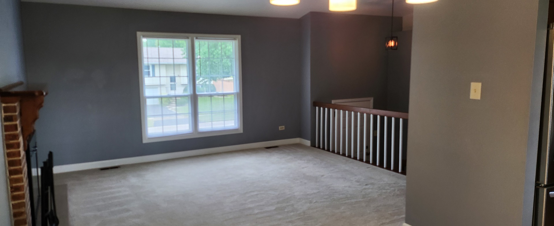 7306 West Mathews Drive Frankfort, IL 60423 - Photo 3 of 26 a view of a hallway with a window